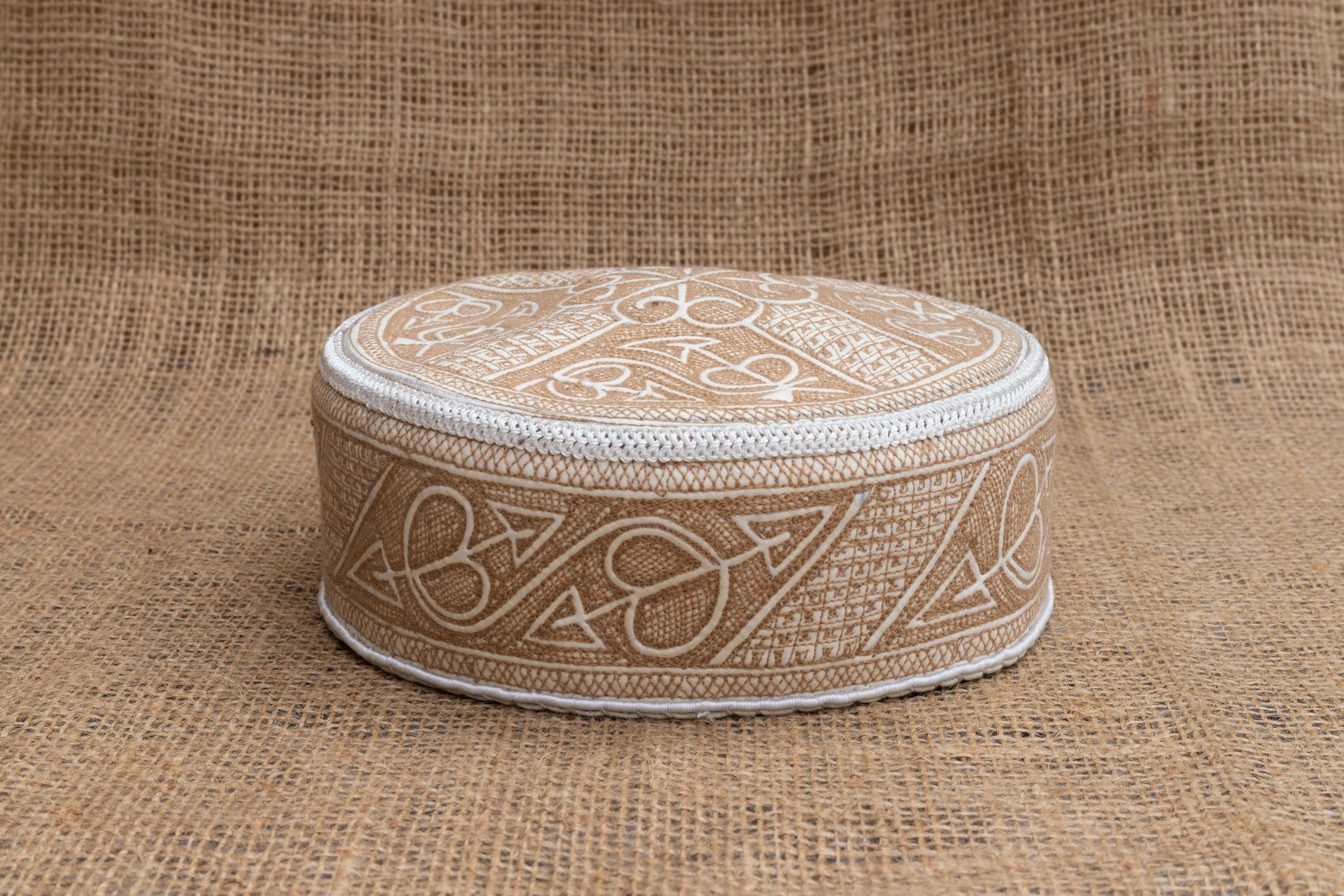 Handmade textile accessory with embroidered detail
