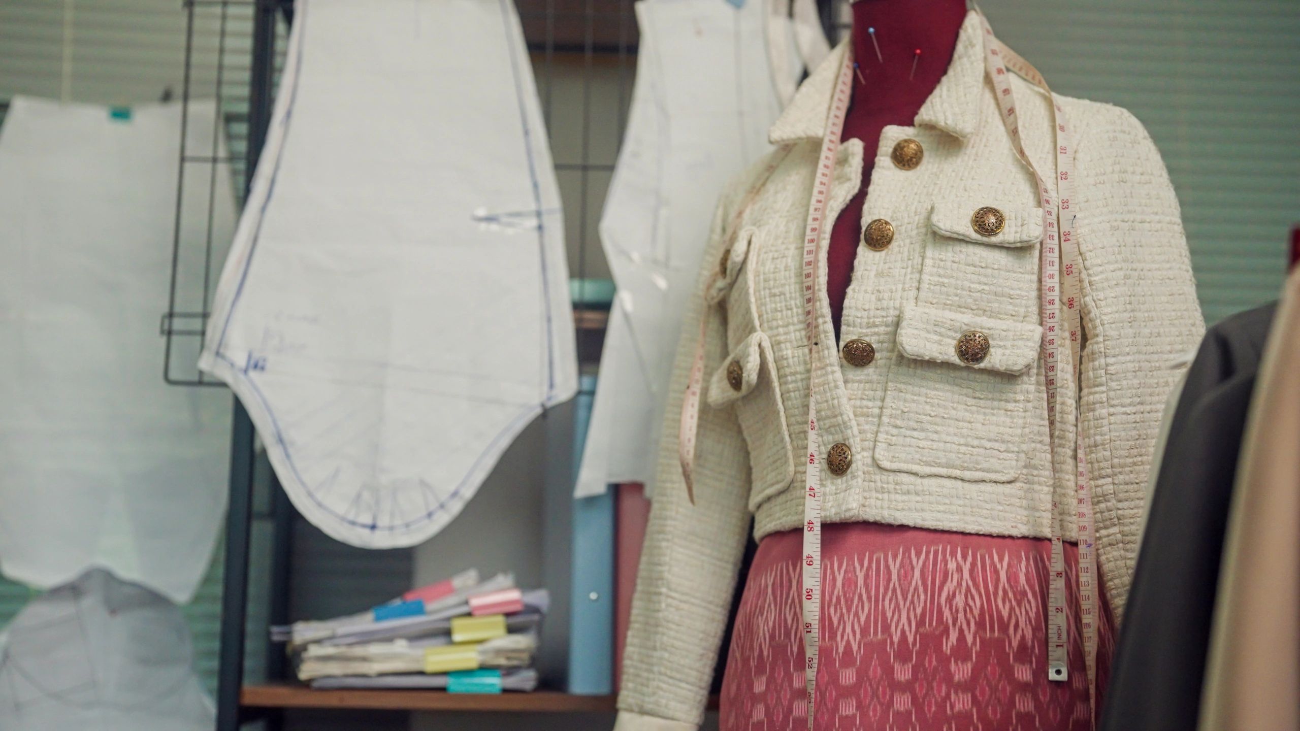 Fashion design studio with garment samples and development workspace